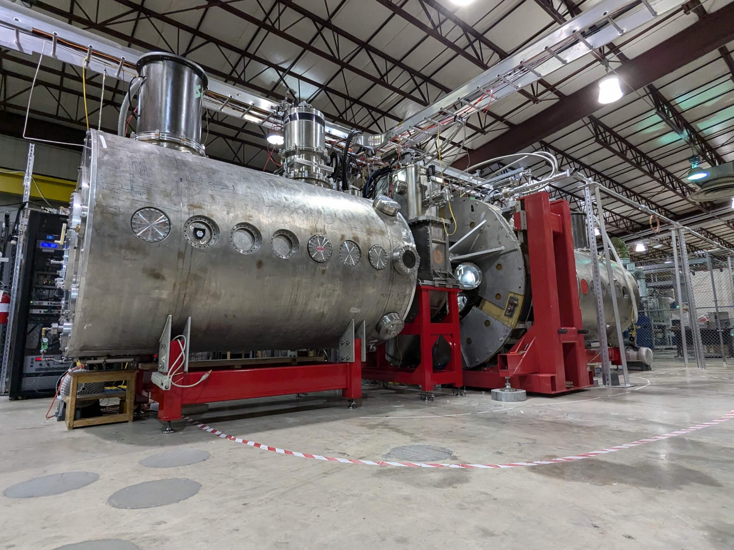 Realta Fusion's device sits in a large warehouse-like building.